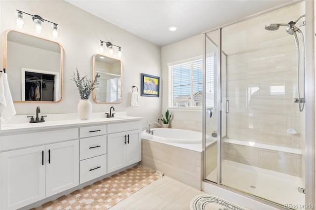 4778 Ravencrest Pl, Castle Rock, CO 80108 - bathroom featuring a stall shower, double vanity, a bath, and tile patterned flooring