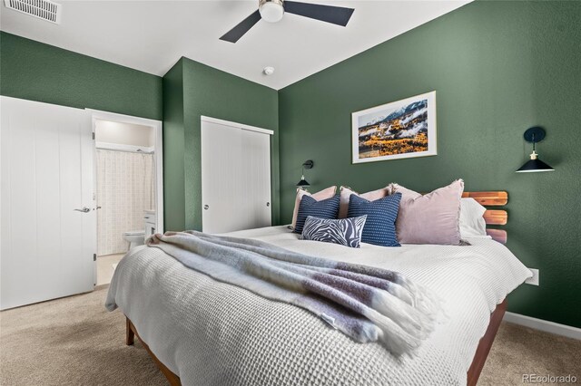 4778 Ravencrest Pl, Castle Rock, CO 80108 - bedroom featuring carpet floors, connected bathroom, ceiling fan, and a textured wall