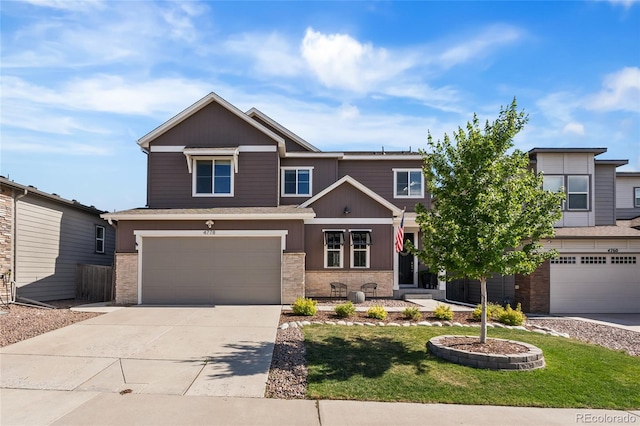 4778 Ravencrest Pl, Castle Rock, CO 80108 - view of front of home featuring an attached garage, concrete driveway, stone siding, and a front yard