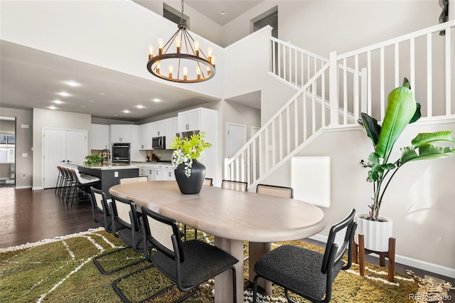 4778 Ravencrest Pl, Castle Rock, CO 80108 - dining room with dark wood finished floors, stairs, and a chandelier