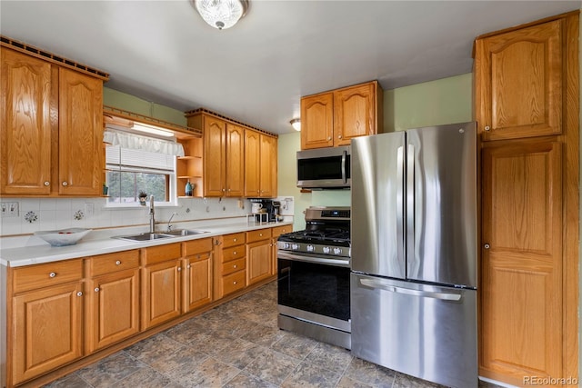 8701 Majestic View Dr, Conifer, CO 80433 - kitchen with appliances with stainless steel finishes, a sink, tasteful backsplash, brown cabinetry, and open shelves