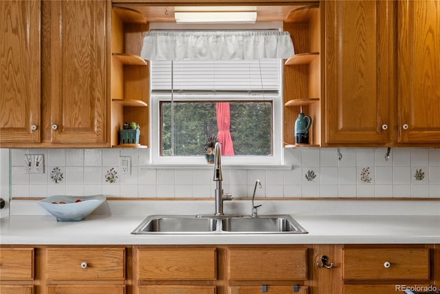 8701 Majestic View Dr, Conifer, CO 80433 - kitchen featuring open shelves, a sink, light countertops, and brown cabinetry