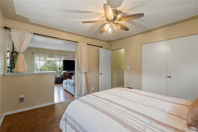 8701 Majestic View Dr, Conifer, CO 80433 - bedroom featuring a closet, a ceiling fan, wood finished floors, and baseboards