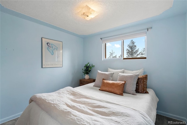 8701 Majestic View Dr, Conifer, CO 80433 - carpeted bedroom featuring baseboards and a textured ceiling