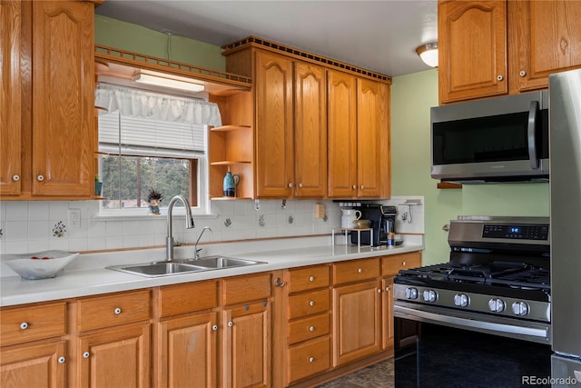 8701 Majestic View Dr, Conifer, CO 80433 - kitchen featuring appliances with stainless steel finishes, a sink, backsplash, and light countertops