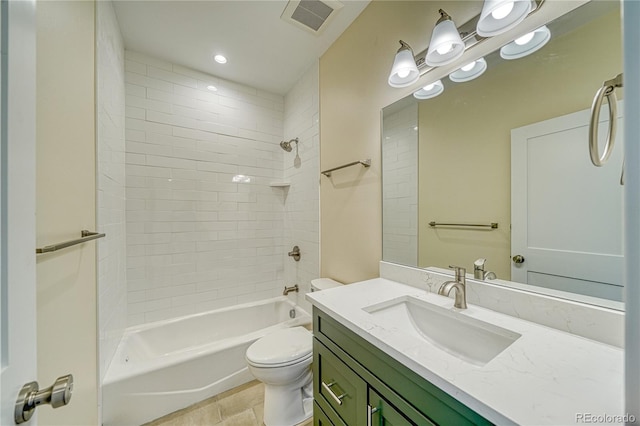 full bathroom with tile patterned flooring, vanity, toilet, and tiled shower / bath