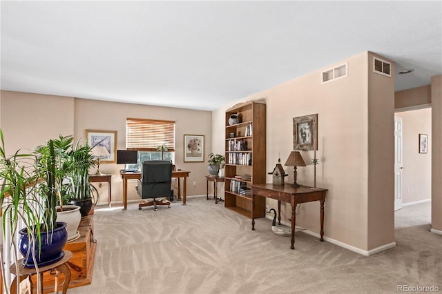 office space with light colored carpet