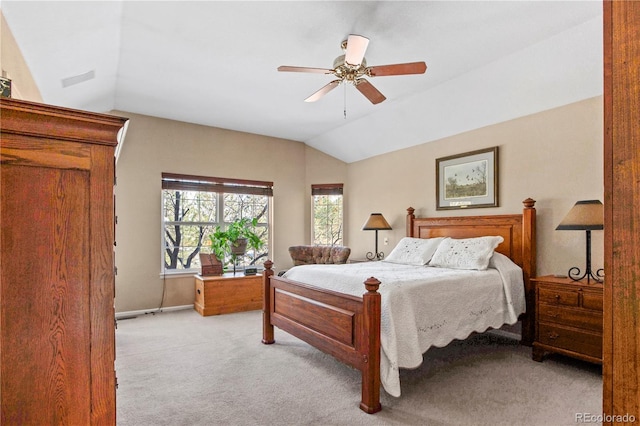 bedroom featuring light colored carpet, ceiling fan, and lofted ceiling