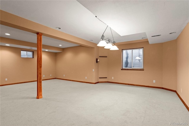 basement featuring light carpet