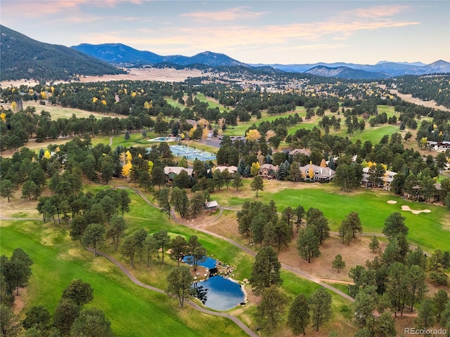 aerial view at dusk with a water and mountain view