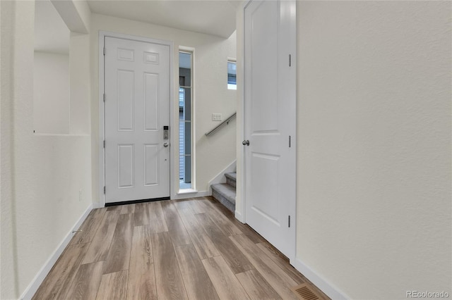 9307 Inca Dove Cir, Littleton, CO 80125 - foyer with wood finished floors and stairway