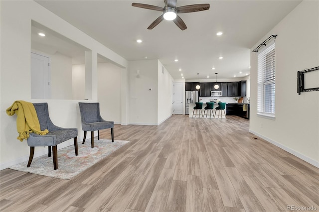 9307 Inca Dove Cir, Littleton, CO 80125 - living area with light wood-type flooring, a ceiling fan, and recessed lighting