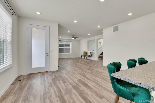 9307 Inca Dove Cir, Littleton, CO 80125 - foyer featuring light wood-style floors, recessed lighting, ceiling fan, and stairs