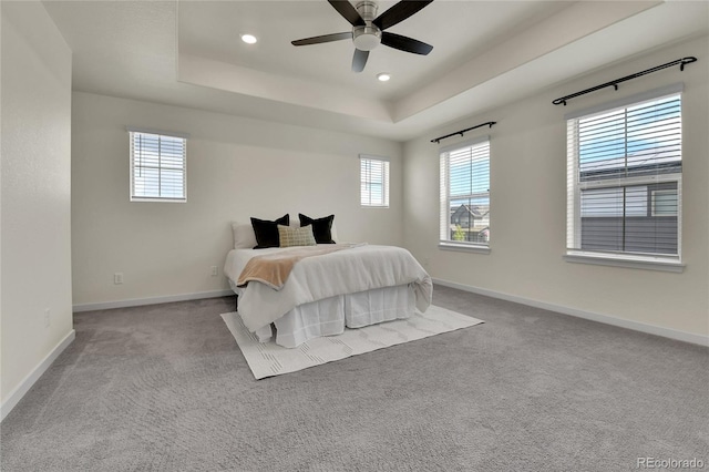 9307 Inca Dove Cir, Littleton, CO 80125 - bedroom with a raised ceiling, carpet flooring, recessed lighting, and a ceiling fan