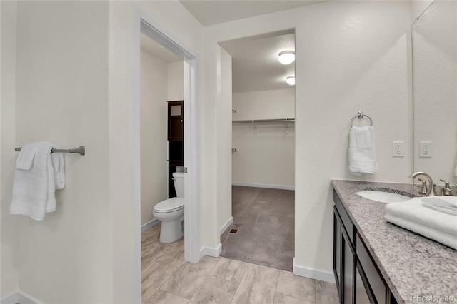 9307 Inca Dove Cir, Littleton, CO 80125 - bathroom with vanity and a spacious closet