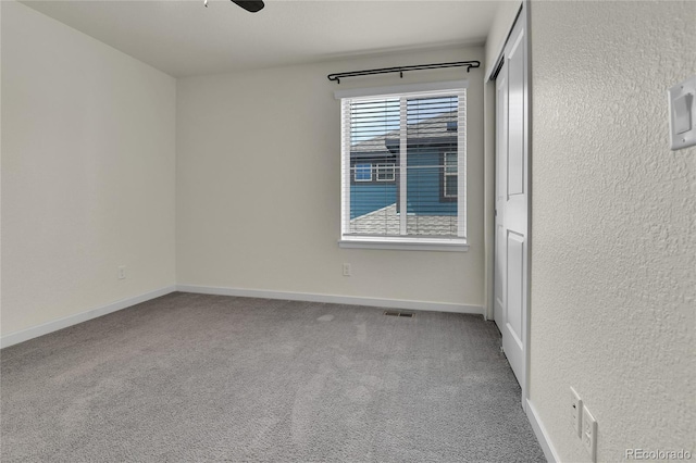 9307 Inca Dove Cir, Littleton, CO 80125 - carpeted empty room featuring ceiling fan and a textured wall