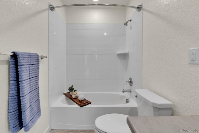 9307 Inca Dove Cir, Littleton, CO 80125 - bathroom featuring shower / washtub combination, a textured wall, and vanity