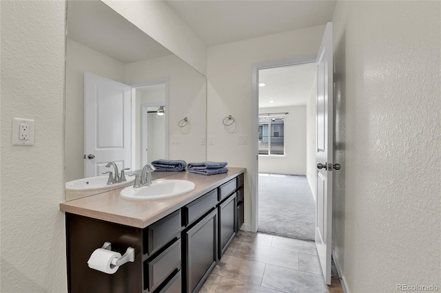 9307 Inca Dove Cir, Littleton, CO 80125 - bathroom with vanity, a textured wall, and tile patterned floors