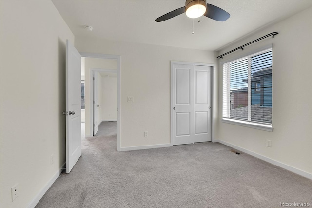 9307 Inca Dove Cir, Littleton, CO 80125 - unfurnished bedroom with carpet floors, a ceiling fan, and a closet