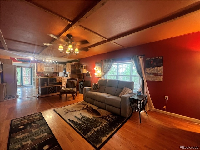 187 Johnson Rd, Bailey, CO 80421 - living area featuring wood finished floors, a ceiling fan, and beam ceiling