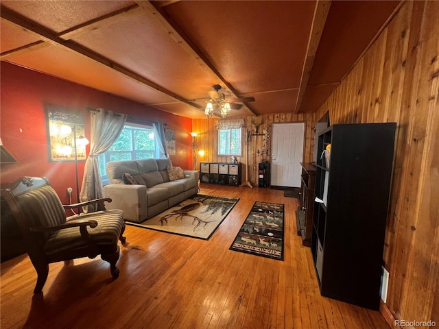 187 Johnson Rd, Bailey, CO 80421 - living area featuring wood-type flooring, wood walls, and a ceiling fan