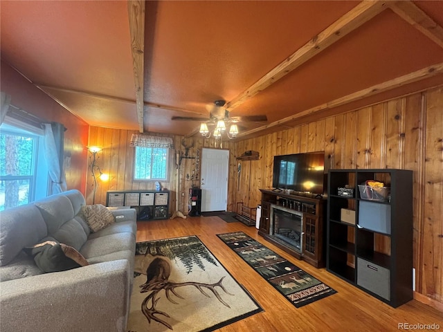 187 Johnson Rd, Bailey, CO 80421 - living room featuring wood walls, wood finished floors, ceiling fan, and beam ceiling