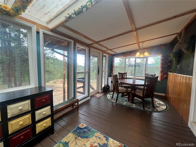 187 Johnson Rd, Bailey, CO 80421 - sunroom / solarium with wood-type flooring, a chandelier, lofted ceiling, and a wooden deck
