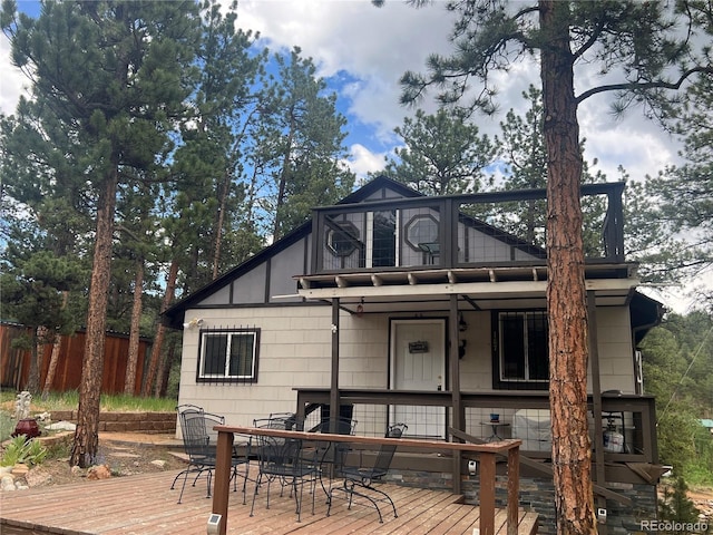 187 Johnson Rd, Bailey, CO 80421 - view of front facade featuring outdoor dining area, a balcony, and a deck