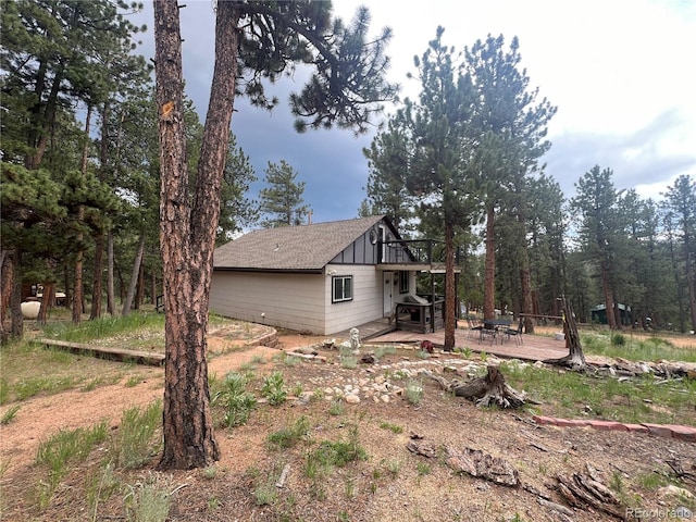 187 Johnson Rd, Bailey, CO 80421 - view of home's exterior featuring a deck, a patio area, and board and batten siding