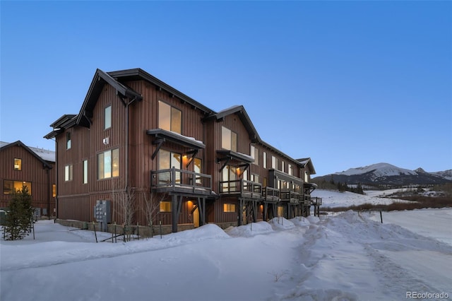 snow covered building with a mountain view