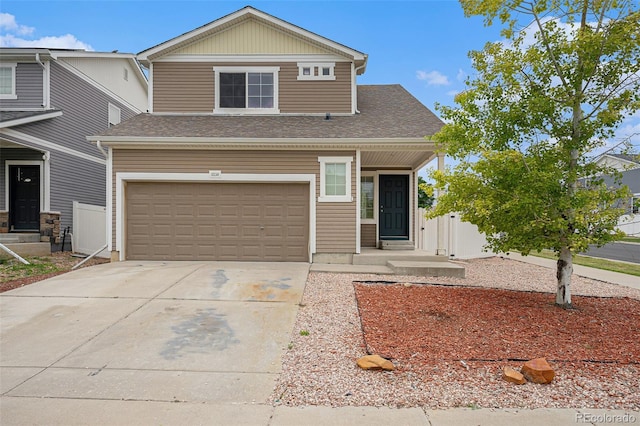 5550 Malta St, Denver, CO 80249 - view of front of property with driveway, a garage, and a shingled roof