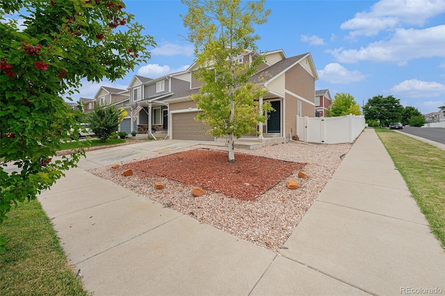5550 Malta St, Denver, CO 80249 - view of front of property with concrete driveway, a garage, and a residential view