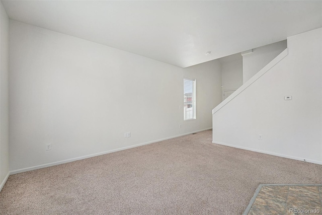 5550 Malta St, Denver, CO 80249 - unfurnished room featuring carpet flooring and stairway