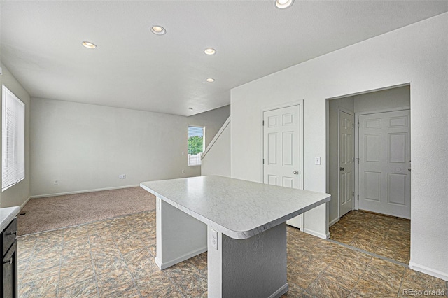 5550 Malta St, Denver, CO 80249 - kitchen featuring recessed lighting, light countertops, and a center island