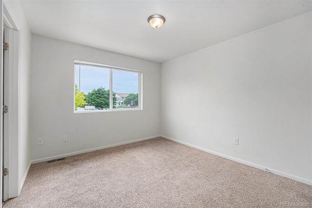5550 Malta St, Denver, CO 80249 - empty room featuring light carpet and baseboards