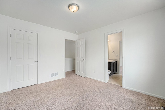 5550 Malta St, Denver, CO 80249 - unfurnished bedroom featuring light colored carpet and ensuite bath
