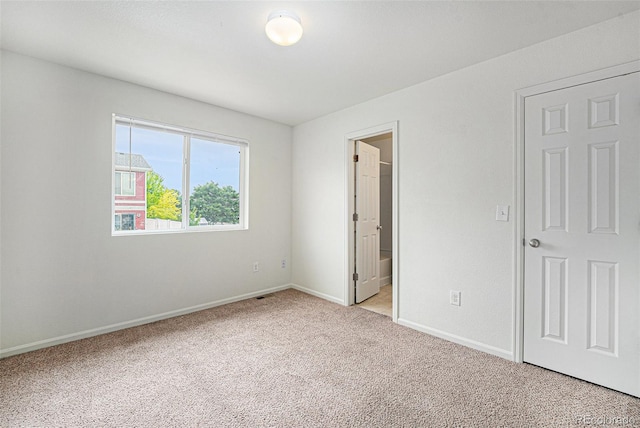 5550 Malta St, Denver, CO 80249 - unfurnished bedroom featuring light carpet and baseboards