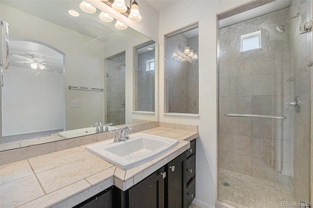 5550 Malta St, Denver, CO 80249 - full bathroom featuring vanity, ceiling fan, and a shower stall