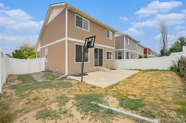 5550 Malta St, Denver, CO 80249 - back of house featuring a fenced backyard and a patio area