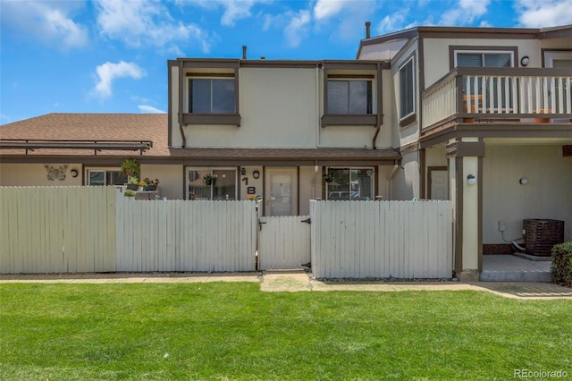 8751 Chase Dr Unit 181, Arvada, CO 80003 - rear view of property featuring a gate and a balcony