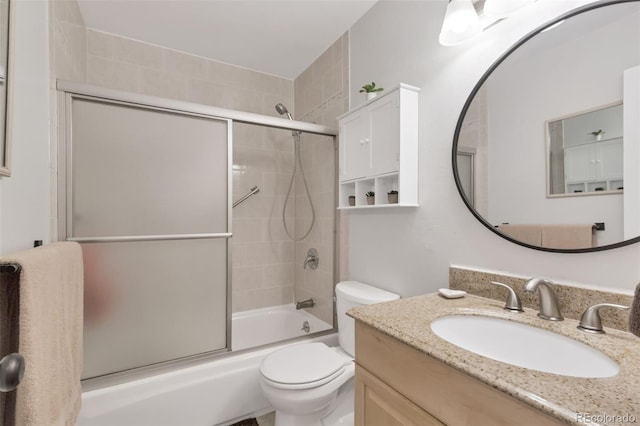 8751 Chase Dr Unit 181, Arvada, CO 80003 - bathroom featuring vanity and bath / shower combo with glass door