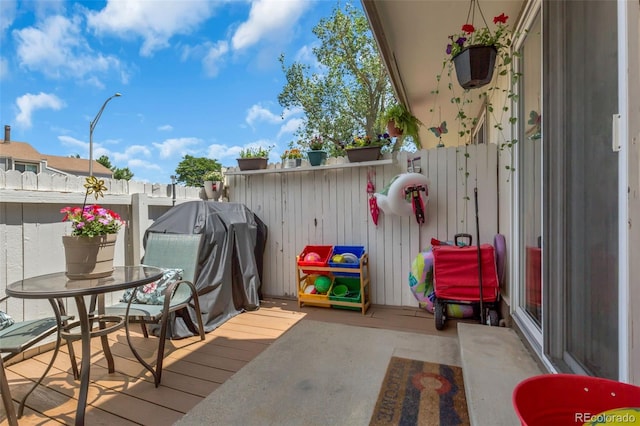 8751 Chase Dr Unit 181, Arvada, CO 80003 - wooden terrace featuring a fenced backyard and a grill