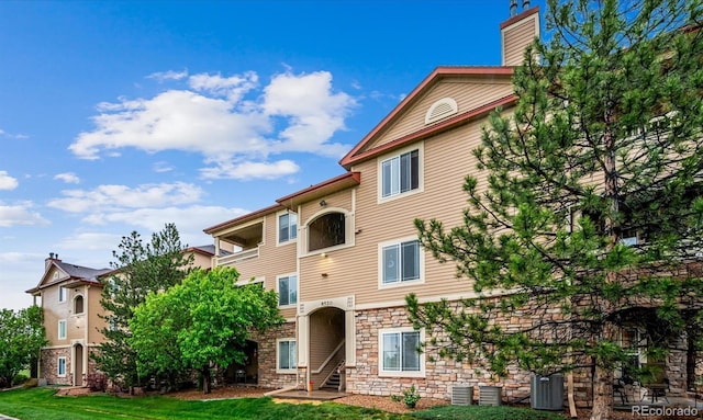 8520 S Holland Ln Unit 102, Littleton, CO 80128 - view of building exterior featuring cooling unit
