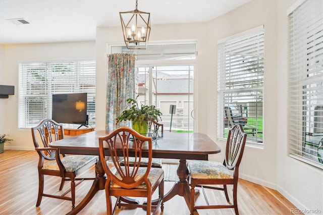 8520 S Holland Ln Unit 102, Littleton, CO 80128 - dining area with light wood-style floors, baseboards, and plenty of natural light