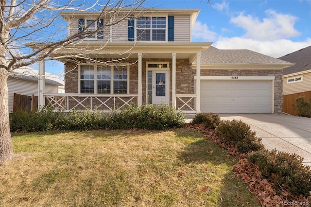 view of front of home with a garage and a front yard