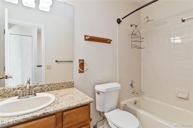 full bathroom with vanity, toilet, and tiled shower / bath