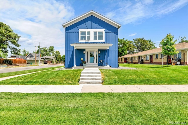 3178 N Race St, Denver, CO 80205 - view of front of property featuring board and batten siding and a front yard