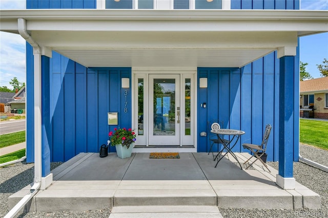 3178 N Race St, Denver, CO 80205 - doorway to property with board and batten siding and a porch