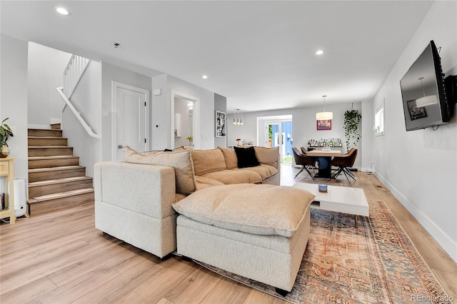 3178 N Race St, Denver, CO 80205 - living room with light wood finished floors, stairway, recessed lighting, and baseboards