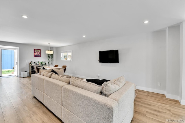 3178 N Race St, Denver, CO 80205 - living area with light wood-style flooring, baseboards, and recessed lighting